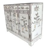 White lacquered Chinese sideboard with mother-of-pearl geisha decorations.