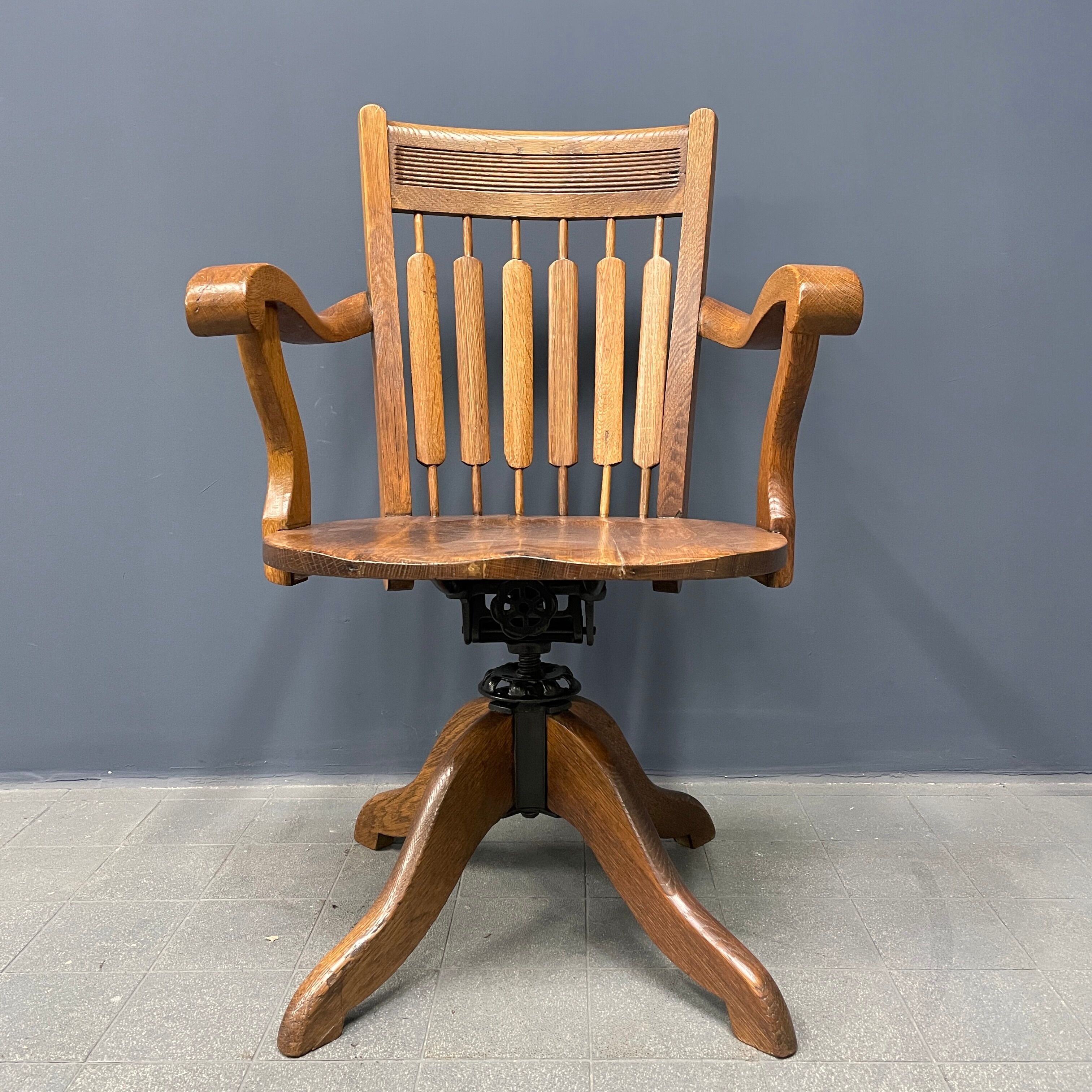 Antique American oak office chair with armrests 1920s