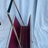 Vintage magazine rack in red skai with gold metal frame and plastic handle