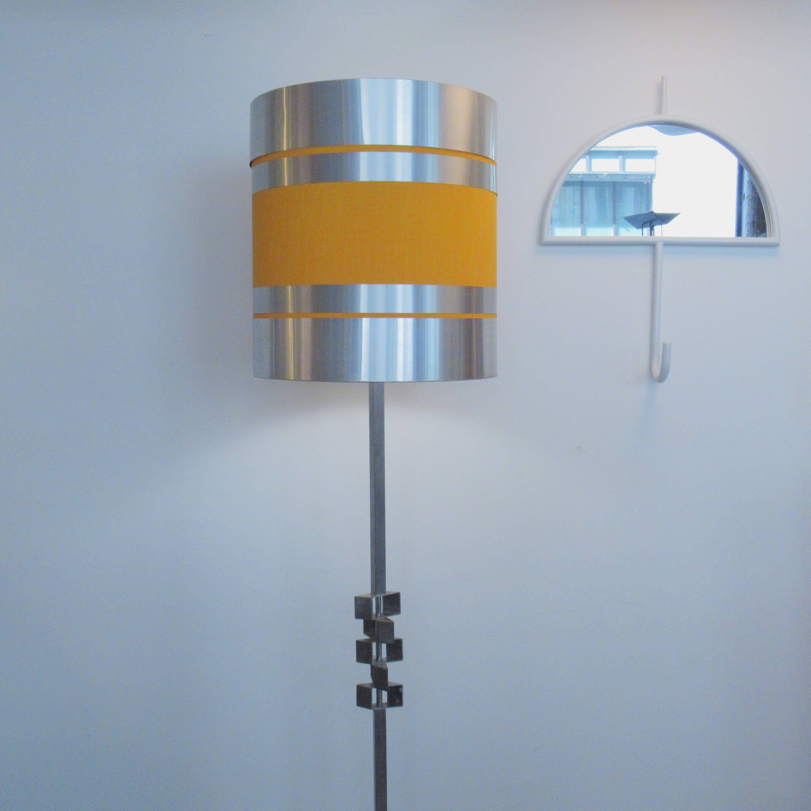 Floor lamp with a large orange shade and metal from the 1960s.