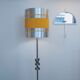 Floor lamp with a large orange shade and metal from the 1960s.