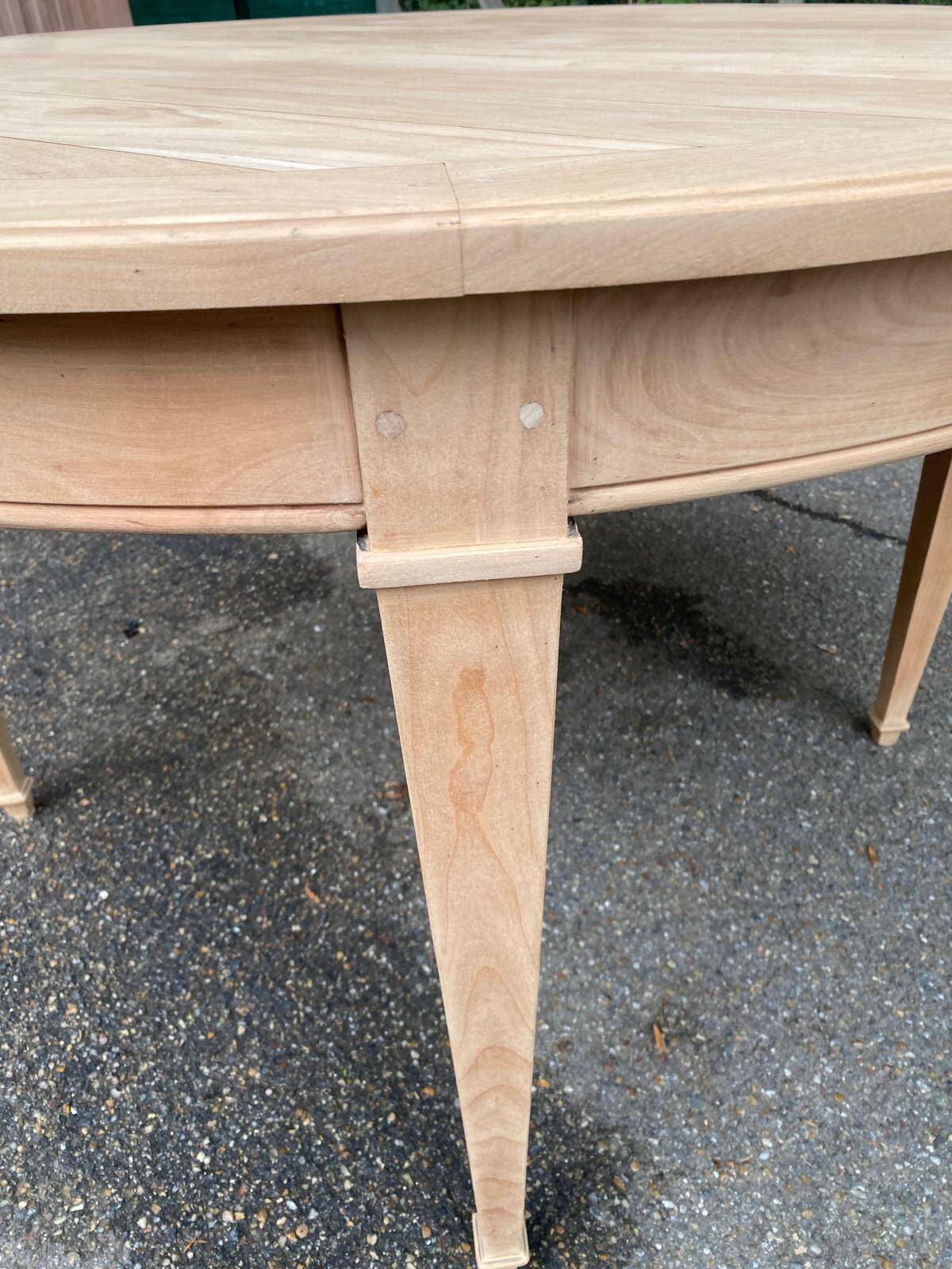 Round extendable dining table stripped in cherry wood Louis XVI René Trotel 1