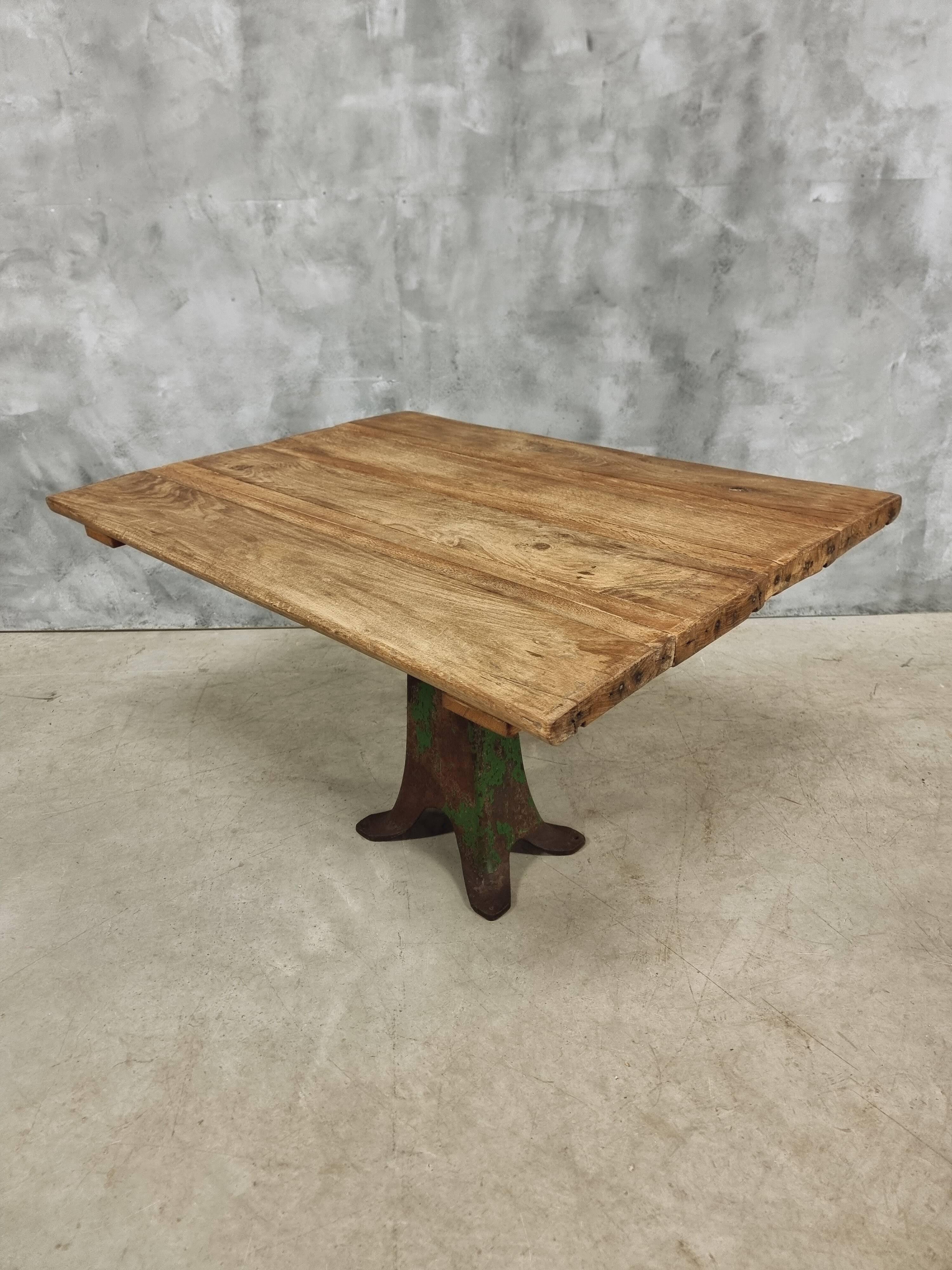 Antique oak dining table on cast iron base 93 x 123 cm