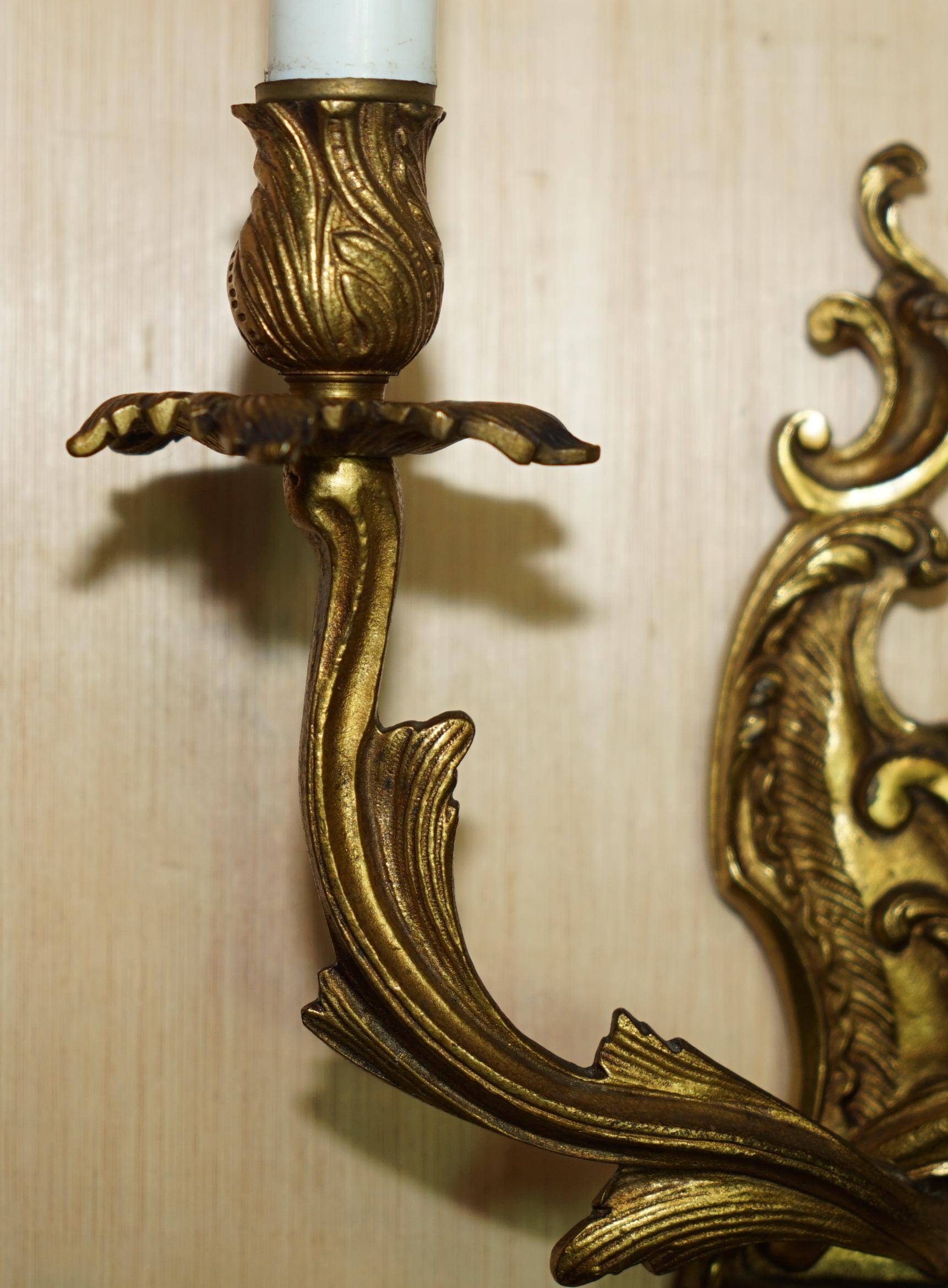 Pair of antique French wall sconces, gilded and bronzed, from the 1920s.