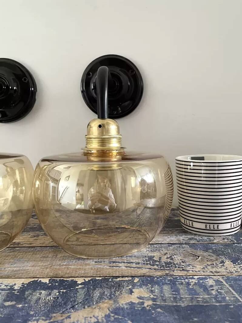 Pair of gold globe wall sconces