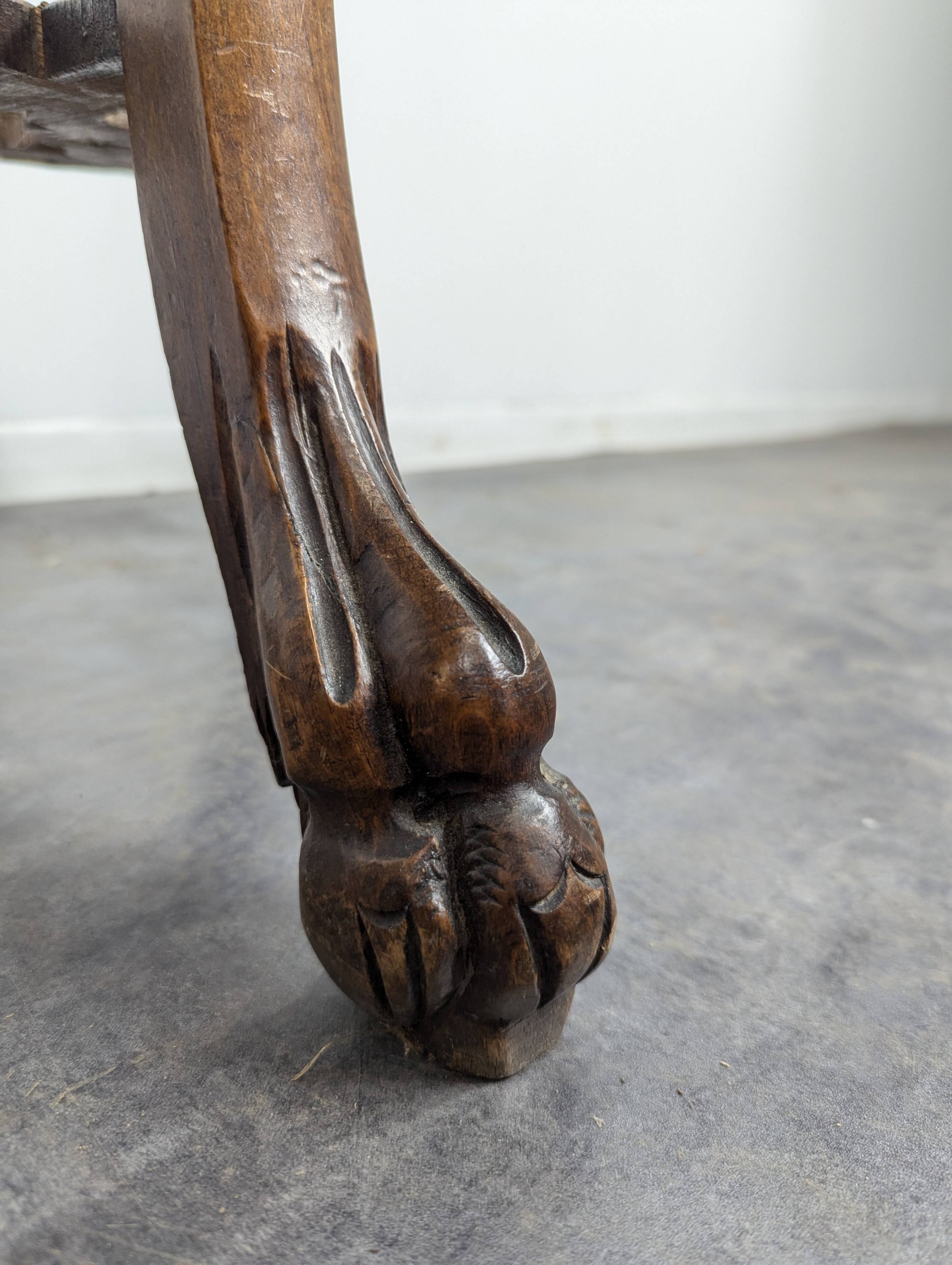 Carved selette with chimera decoration