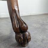 Carved selette with chimera decoration