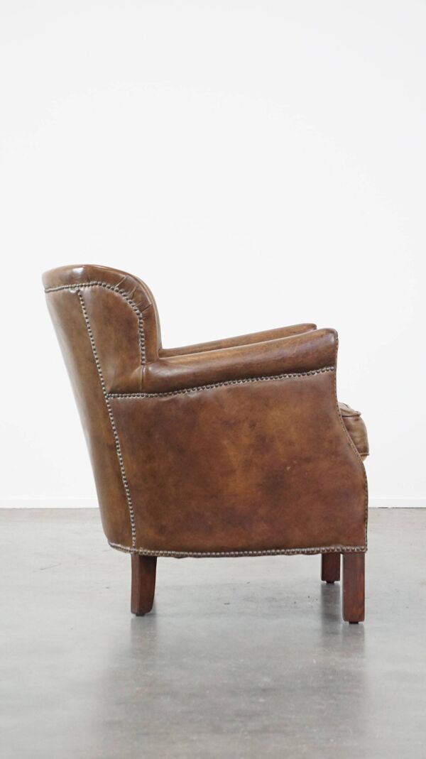 Fauteuil en cuir subtil avec coussin d'assise réversible en kilim