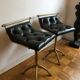 Pair of Chesterfield style brass and leather stools
