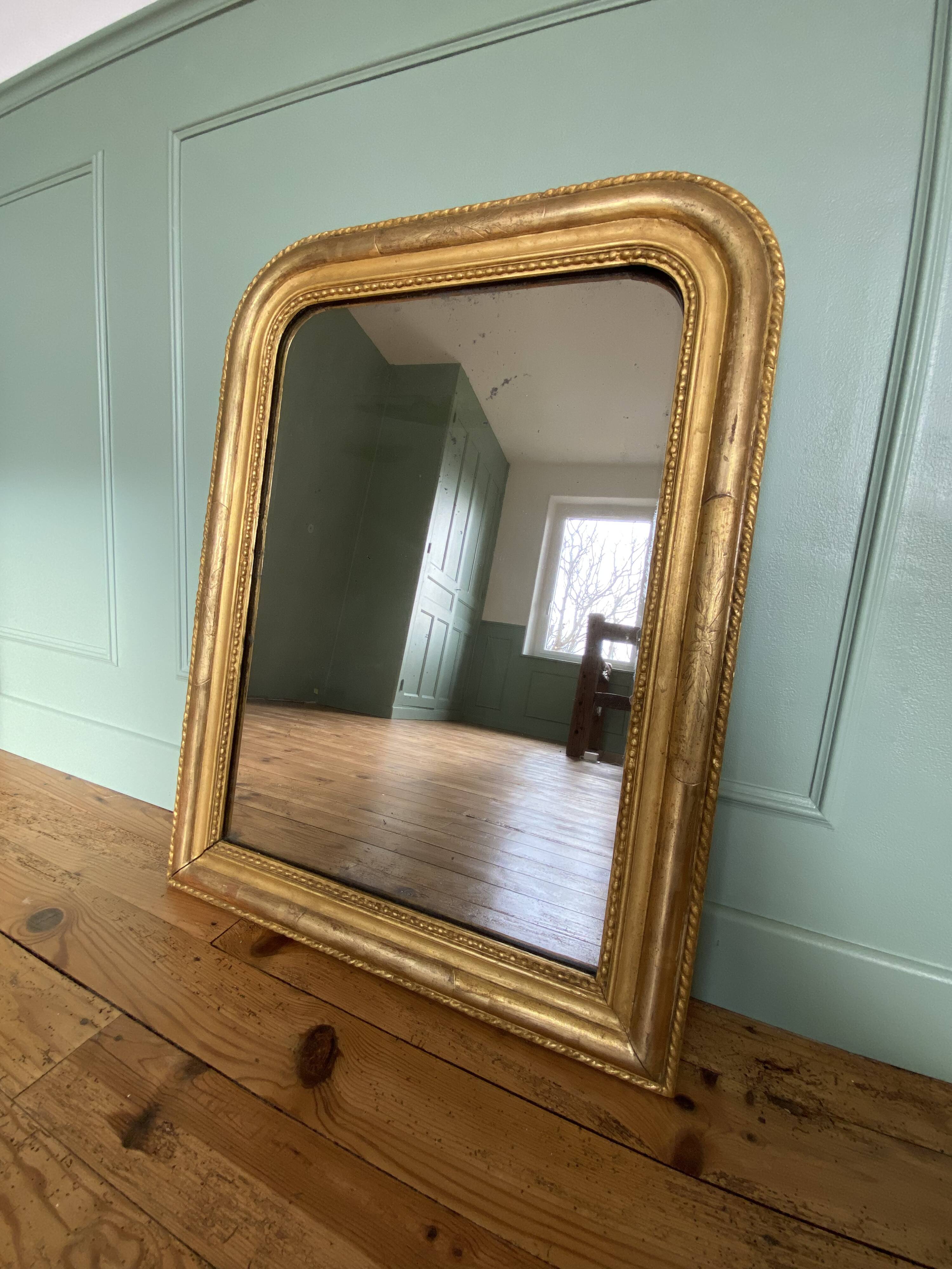 Louis-Philippe mirror gilded with gold leaf