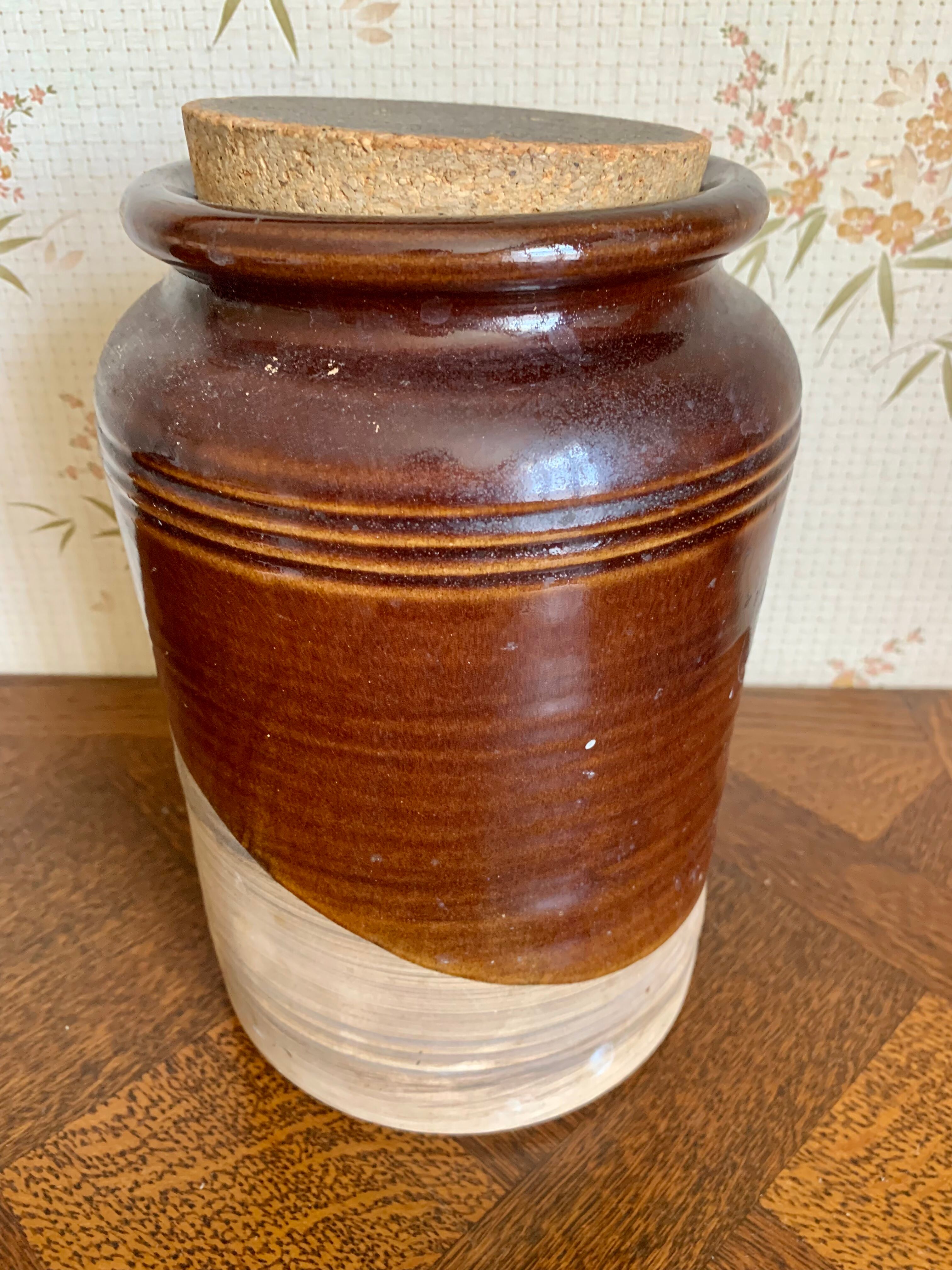 Old sandstone pot with cork lid