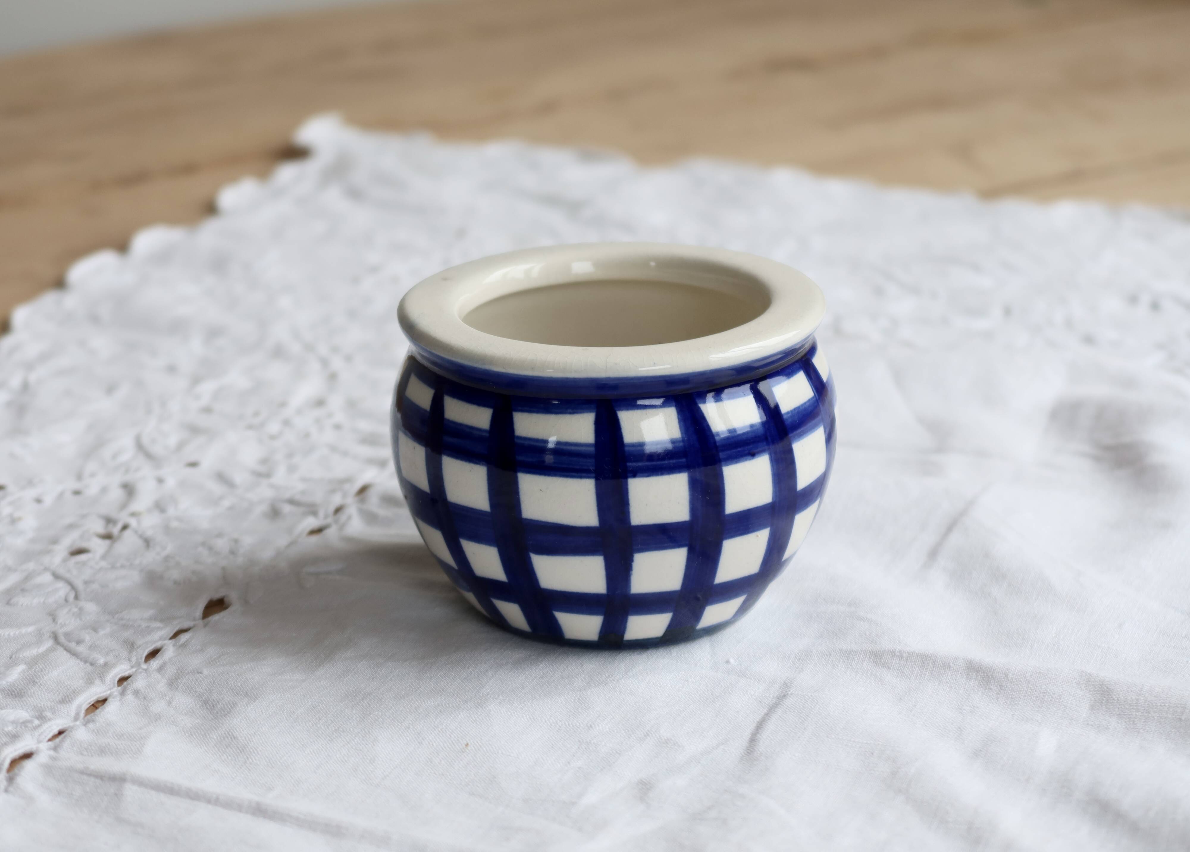 Vintage ceramic cache-pot with navy blue gingham pattern.