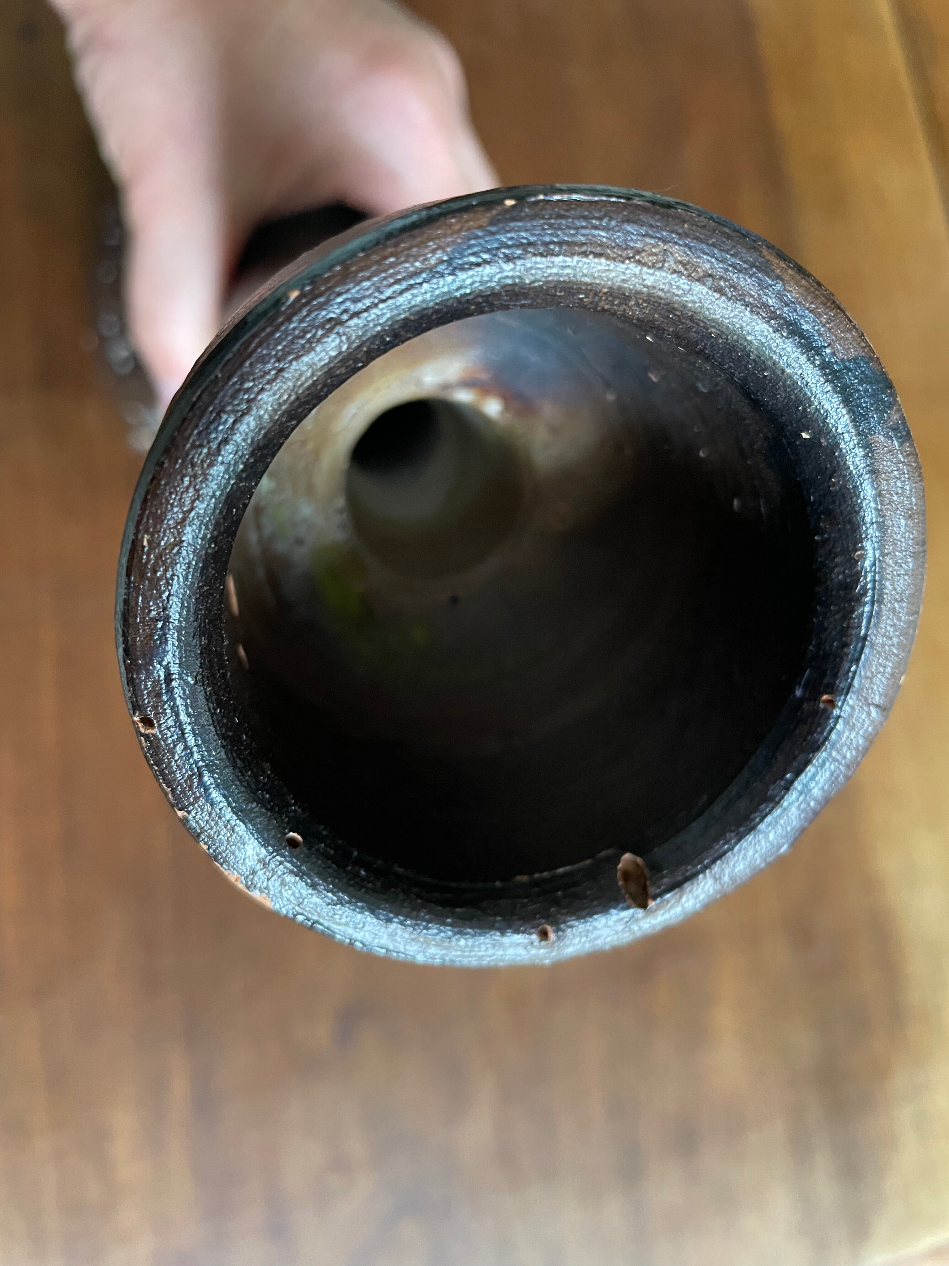 Brown enamelled terracotta candle holder