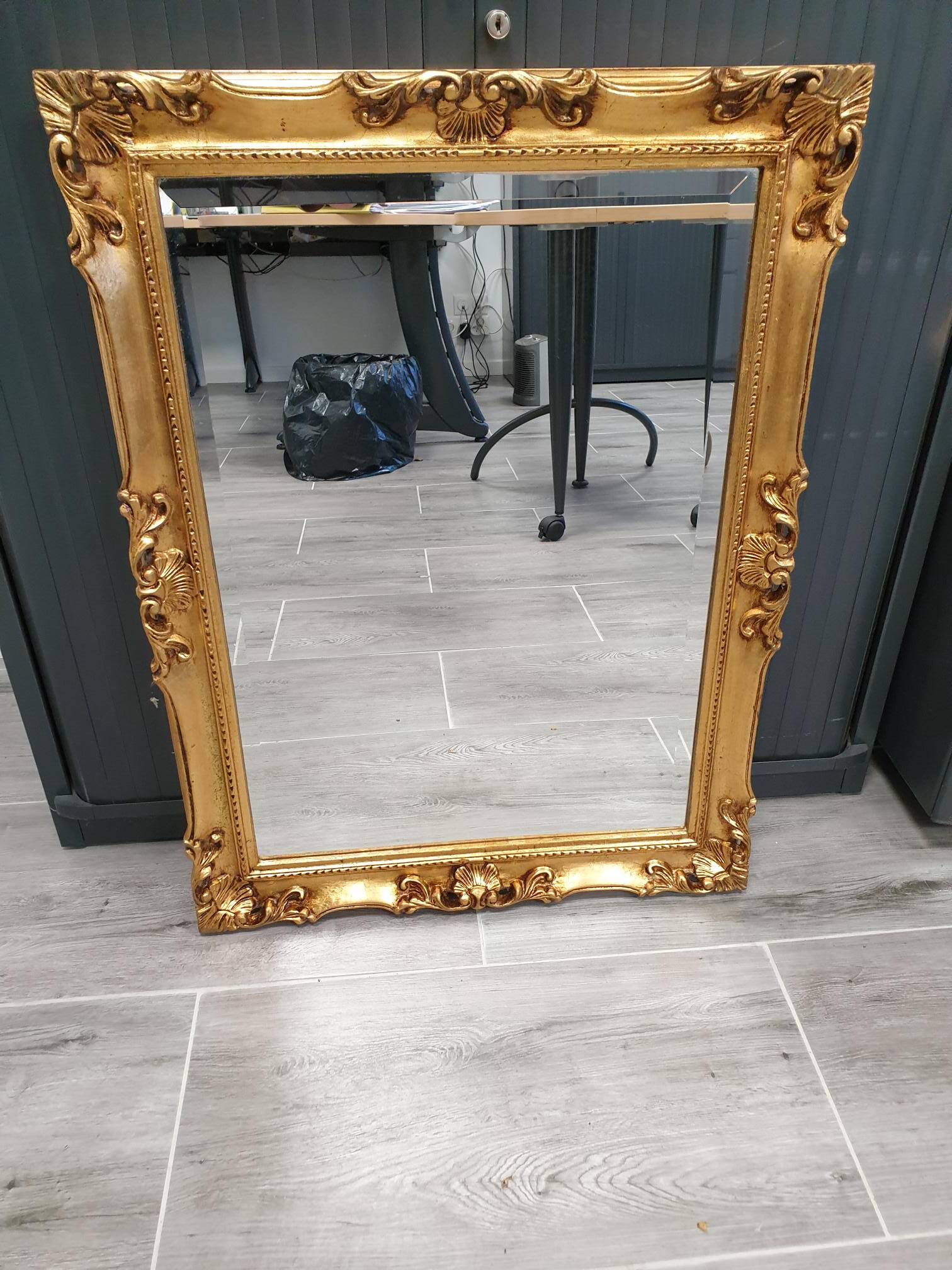 Beveled mirror and golden wood