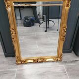 Beveled mirror and golden wood