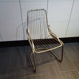 Chaise métallique tubulaire recouverte de dorure
