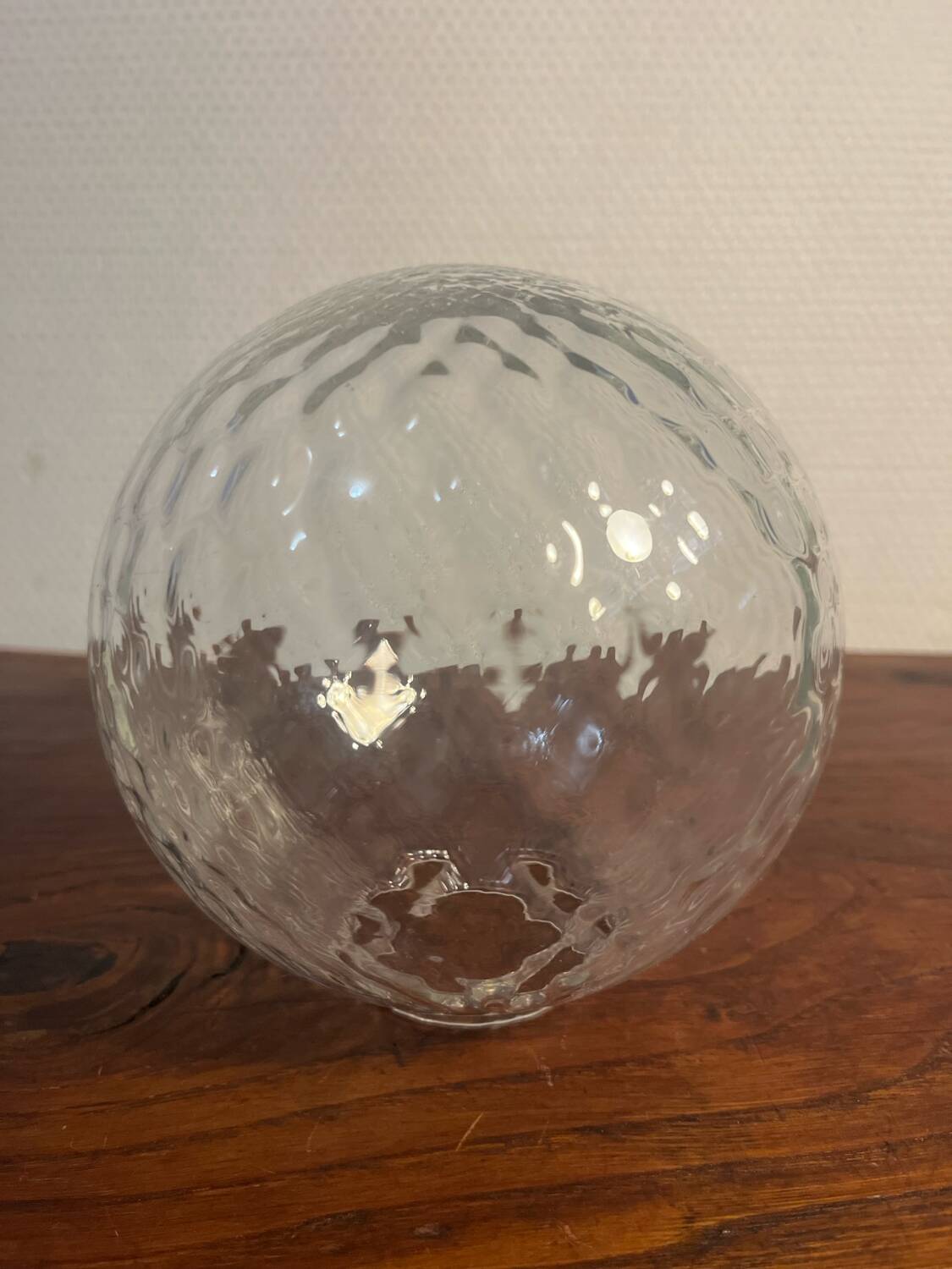 Delmas chrome wall light with chiseled glass globe