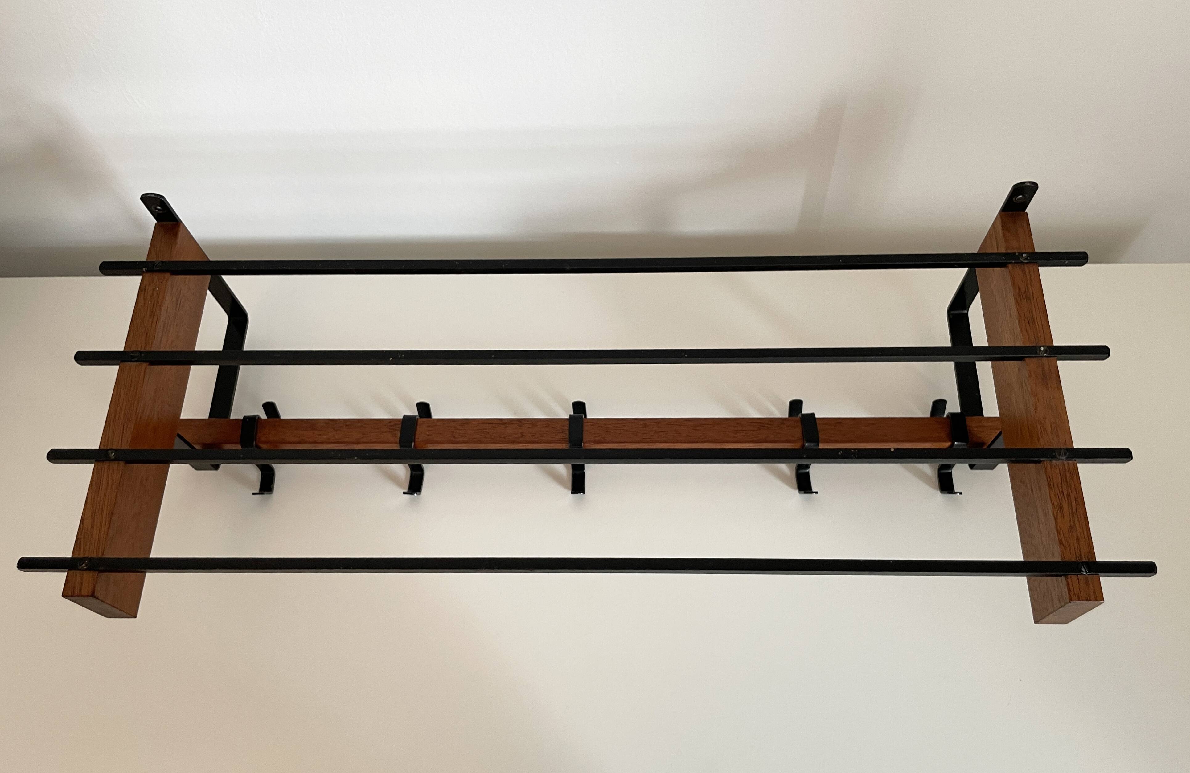 Vintage Scandinavian wall coat rack in wood and metal.