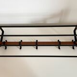 Vintage Scandinavian wall coat rack in wood and metal.
