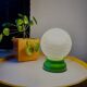 Vintage French table lamp with glass opaline shade and wooden green lamp base.