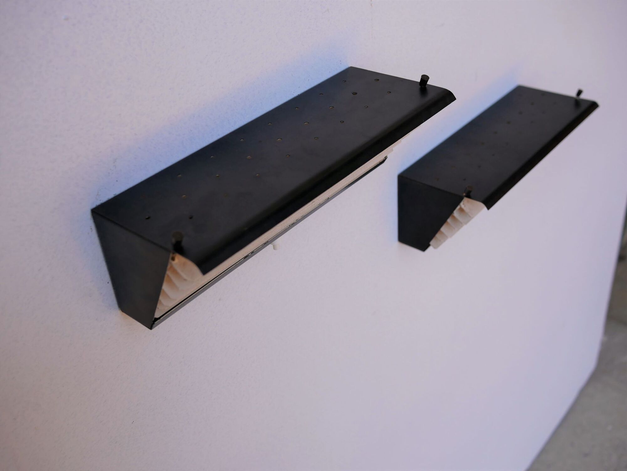Pair of modernist metal wall light model 212, by Jacques Biny for Luminalite