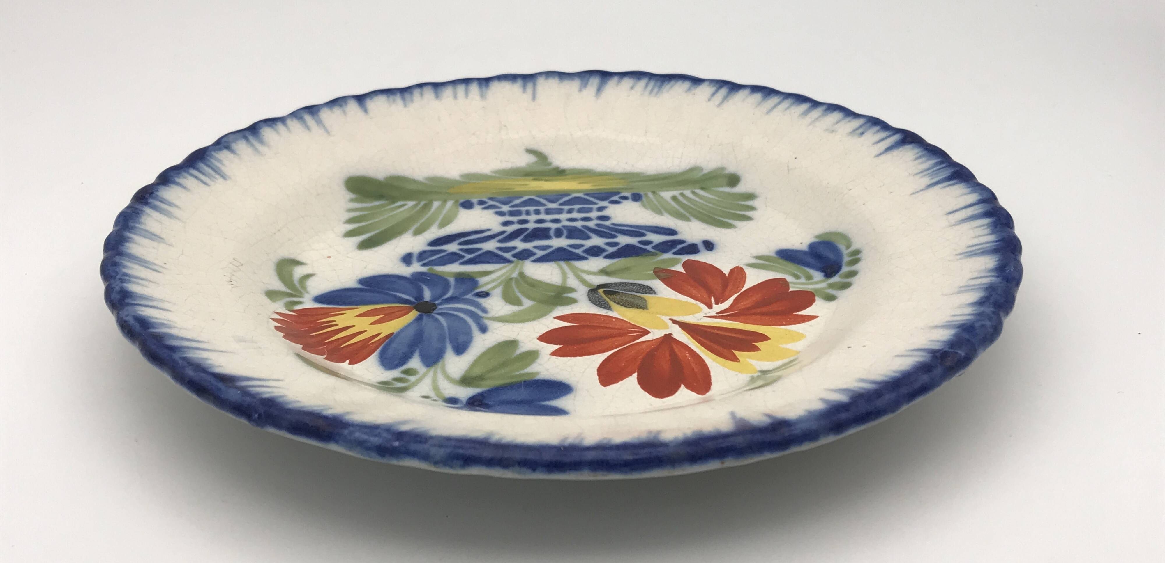 Antique auvillar earthenware plate decorated with basket of polychrome flowers