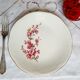 Flat earthenware plates with gilded edges