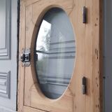 Old bullseye window with oval glass