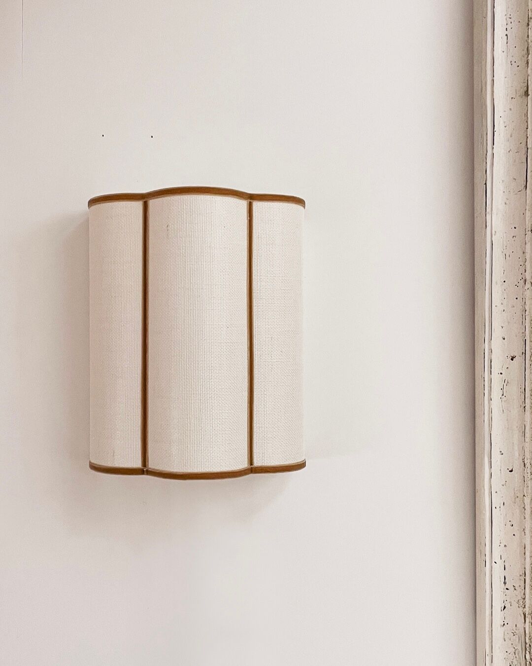 Cream jute wall sconces and bronze velvet trims