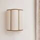 Cream jute wall sconces and bronze velvet trims