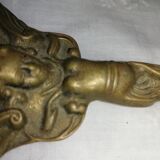 Old hand-facing mirror in gilded bronze