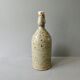 Sandstone bottle signed Guy Baudat, 70s