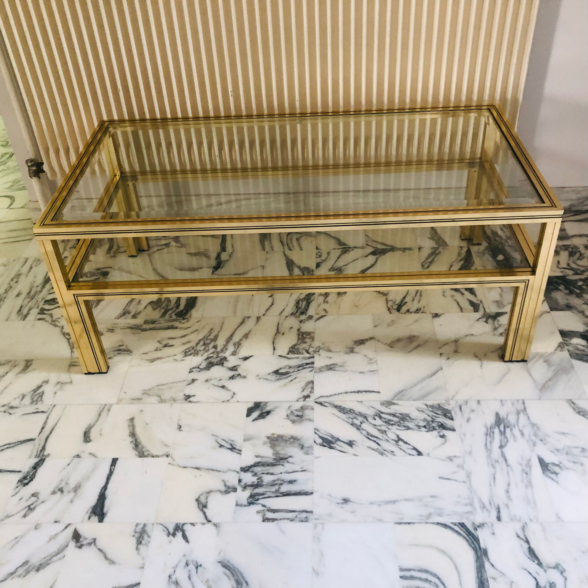 Coffee table with 2 brass and glass tops signed Pierre Vandel Paris, circa 70s.