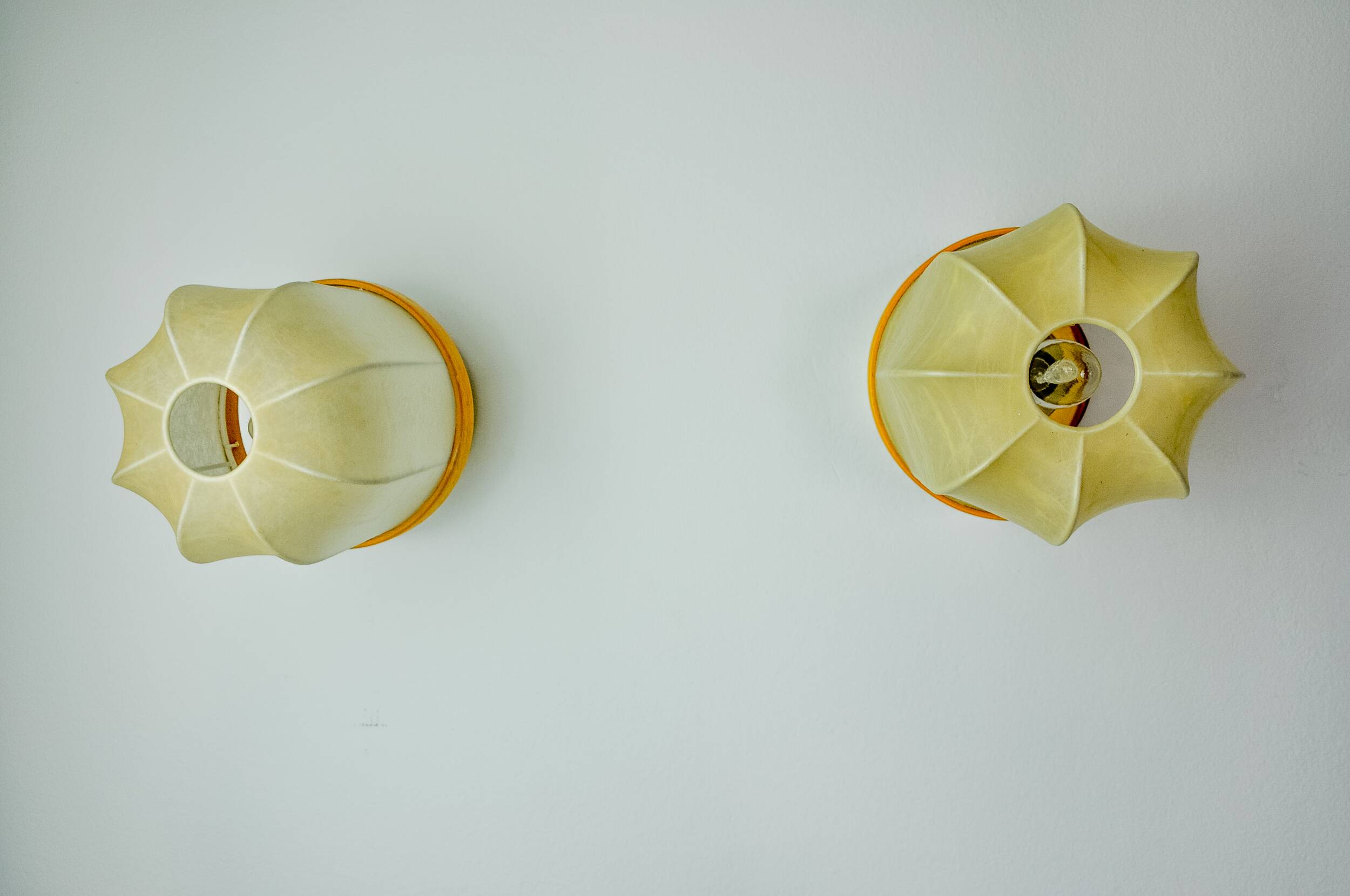 Pair of "cocoon" wall lights, resin and pine, Italy, 1970