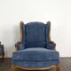 Pair of Louis XV style wingback armchairs in blue velvet.