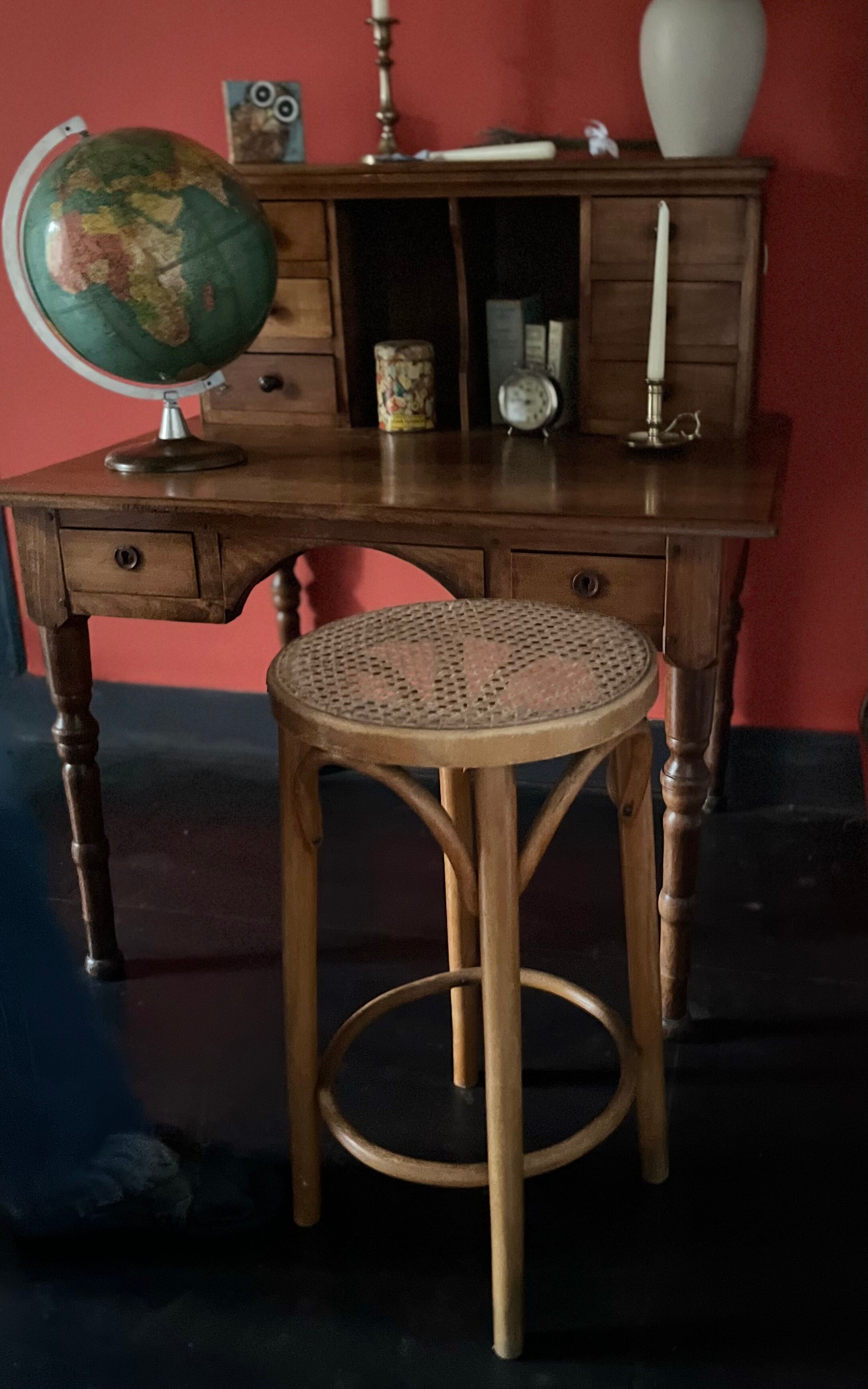 Curved wooden stool and cannage