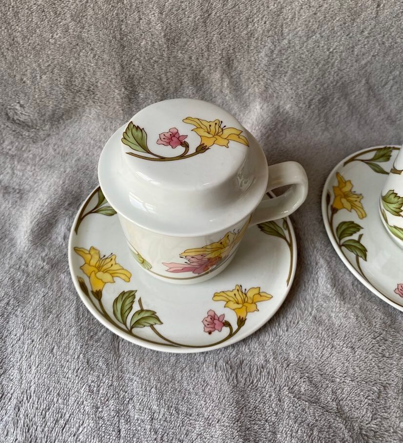 Two cups with herbal tea from the Faiencerie of Pillivuyt