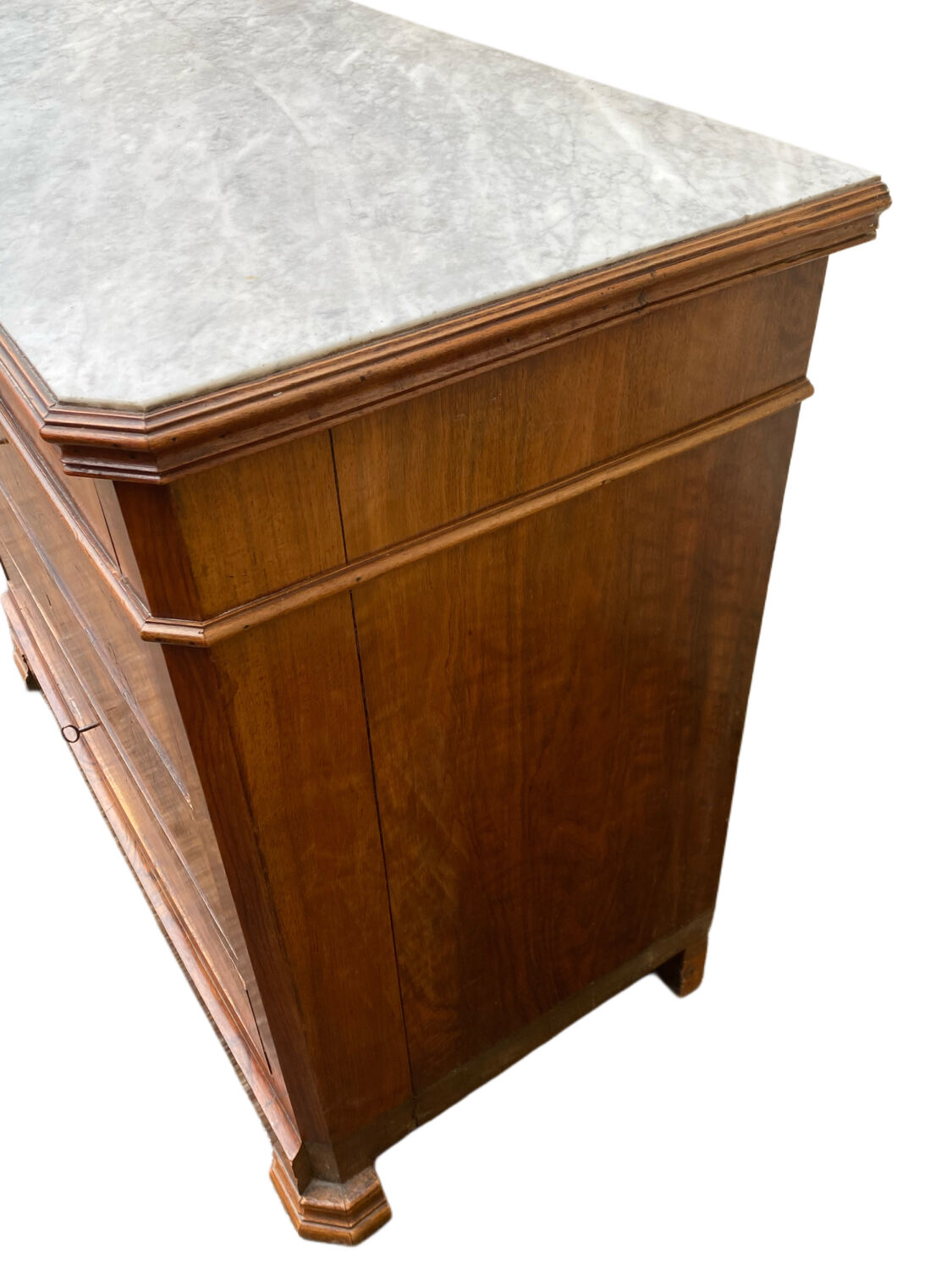 Antique Louis Philippe style chest of drawers with a white marble top.