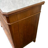 Antique Louis Philippe style chest of drawers with a white marble top.