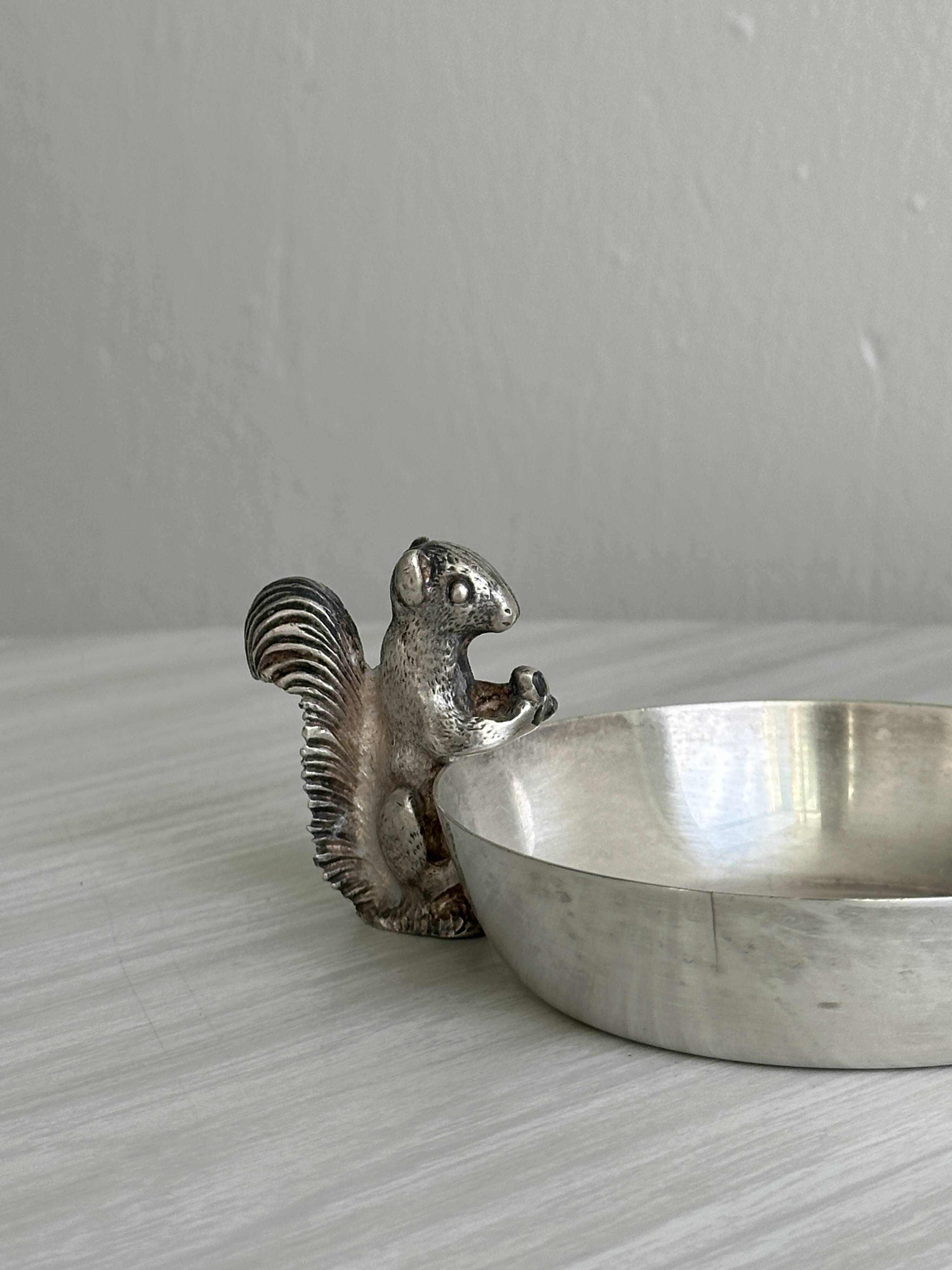 Metal cup with squirrel