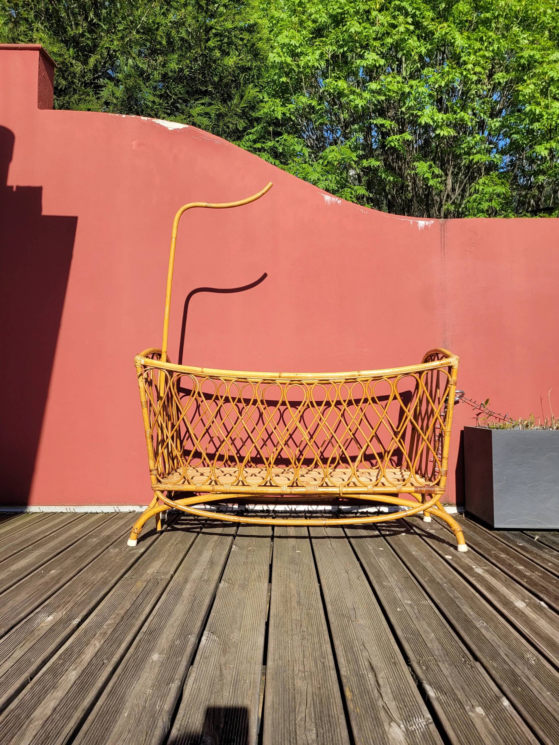 Bamboo and rattan baby cot with canopy.