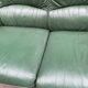 Vintage 2-seater sofa in green leather and solid wood