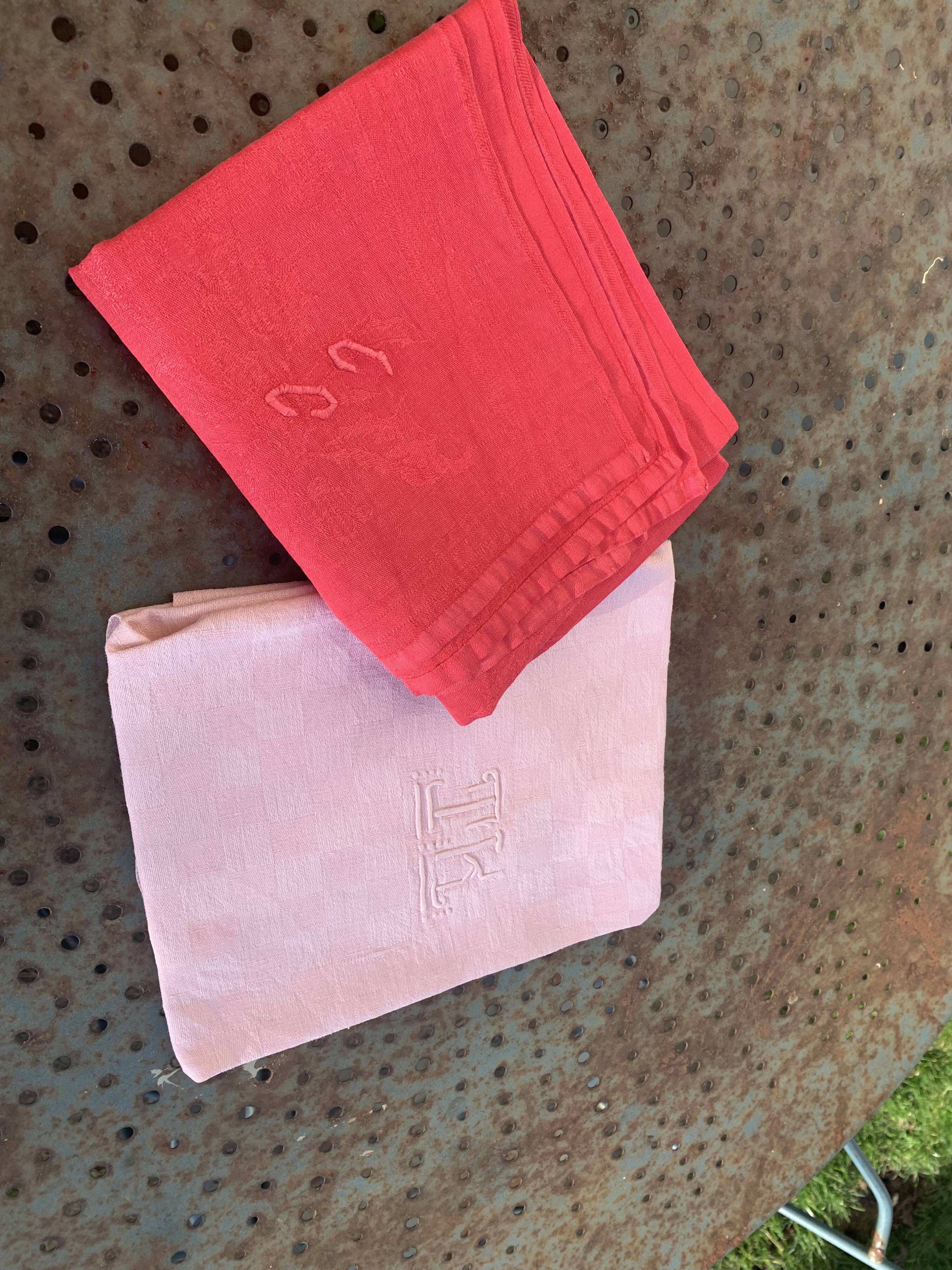 Duo set, consisting of two large pink-dyed cotton and linen towels, embroidered, TK monograms