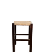 Vintage rustic stool in wood with a straw seat.