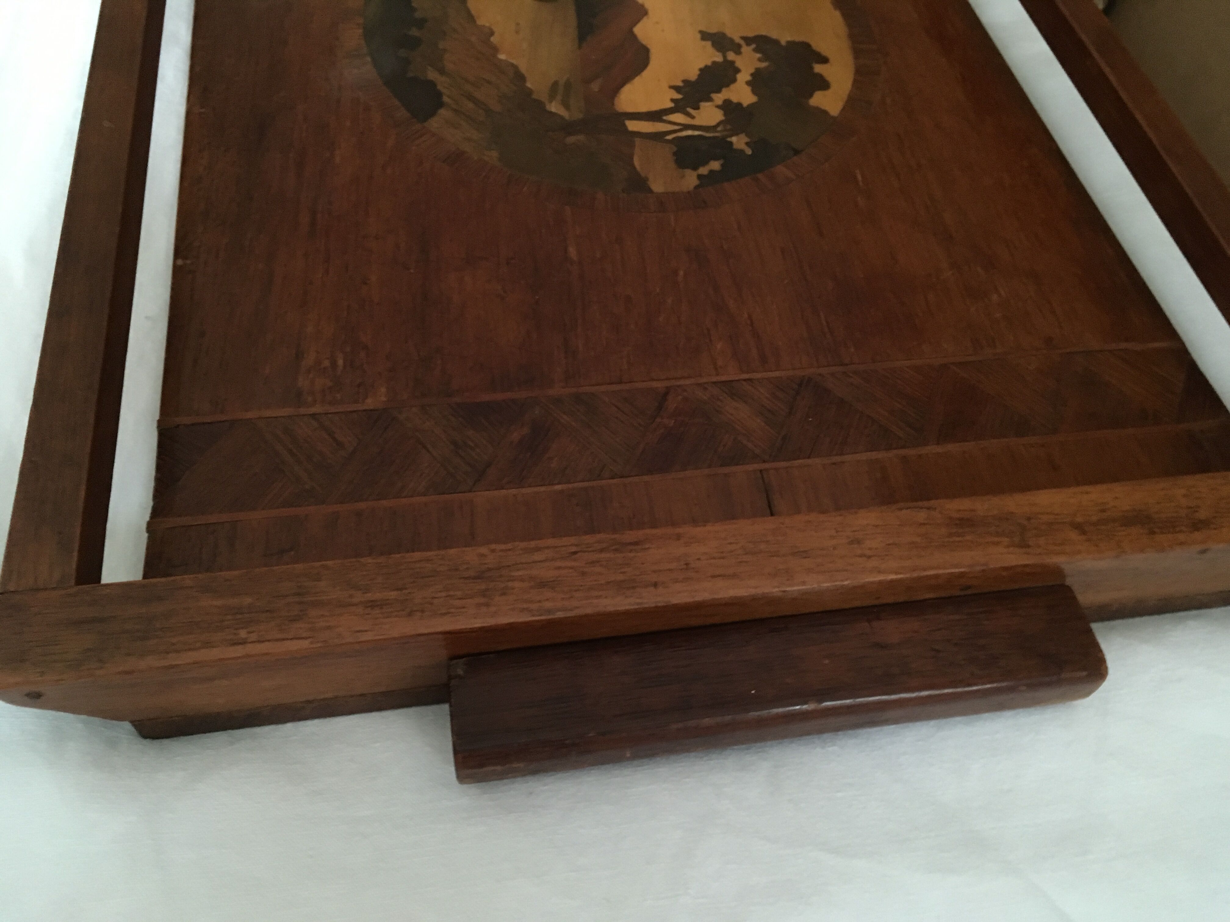 Old wooden serving tray with marquetry drawing