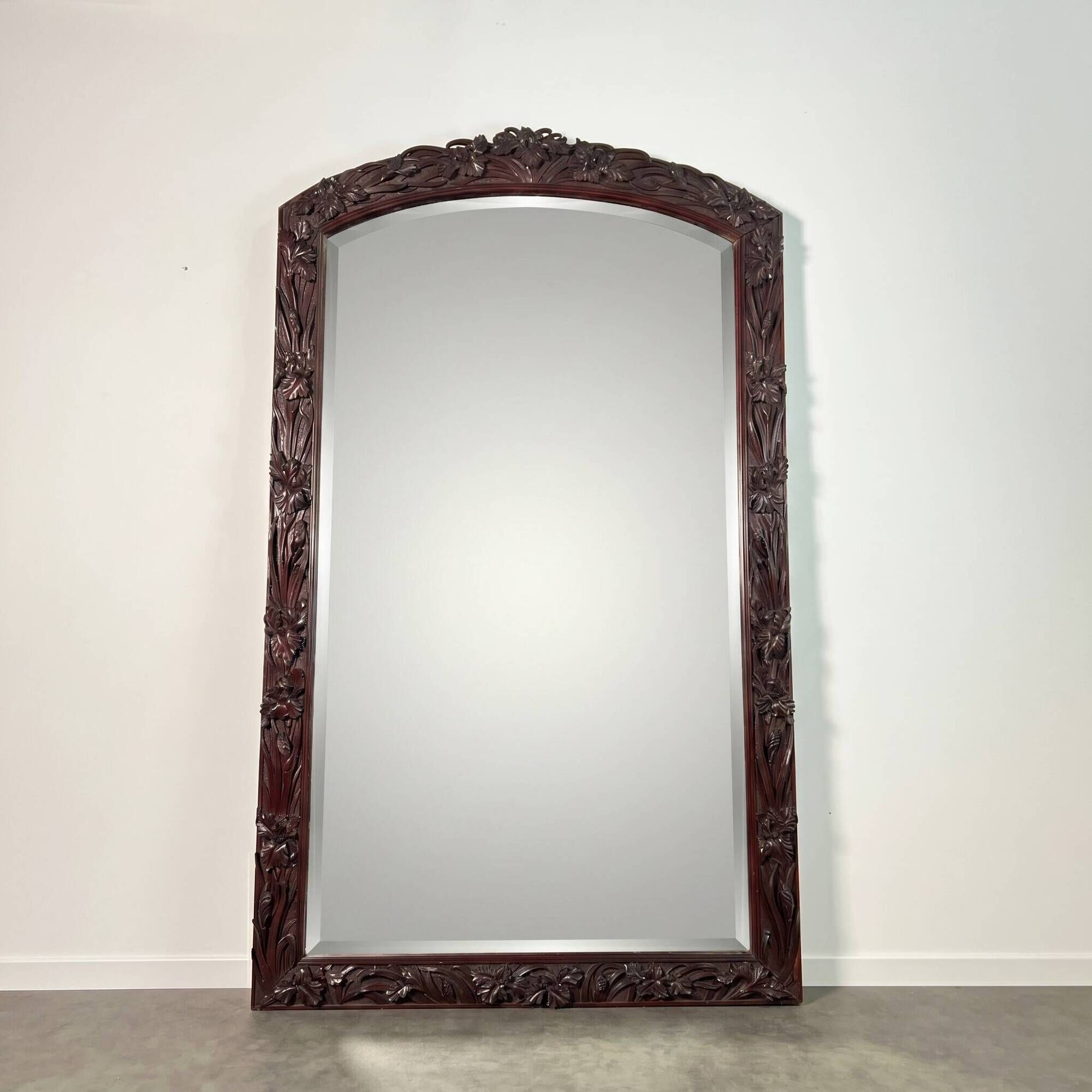 Large mirror (2 metres) Art Nouveau in carved mahogany with high-relief decoration.
