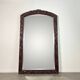 Large mirror (2 metres) Art Nouveau in carved mahogany with high-relief decoration.