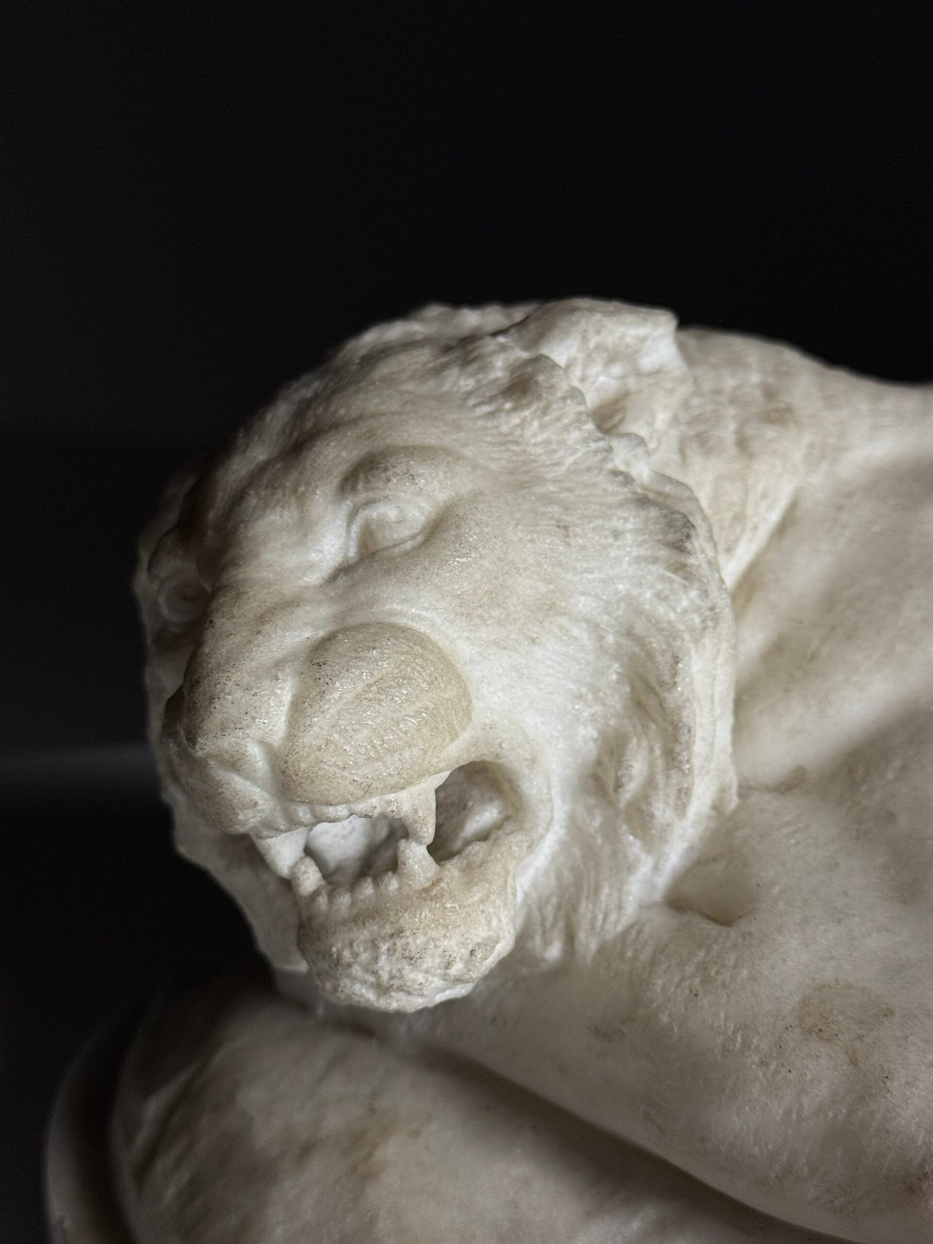 Marble sculpture of a reclining lion