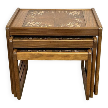 Set of 3 nesting tables in teak with tiled tops.