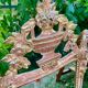 Mirror above a wooden and gilded stucco fireplace in the style of the 18th century.